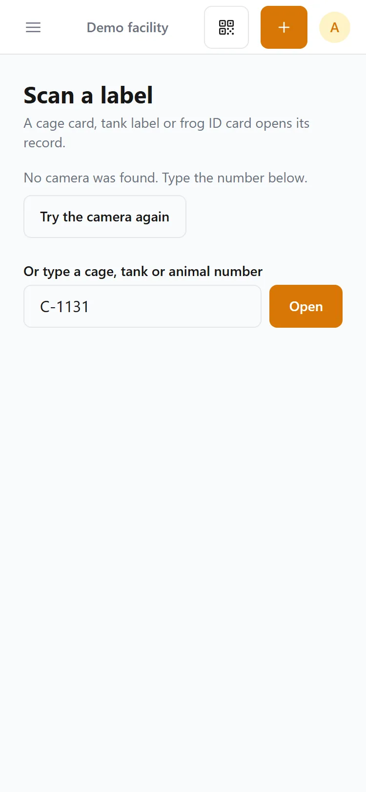 The Scan screen on a phone with cage number C-1131 typed in under the camera, ready to open.